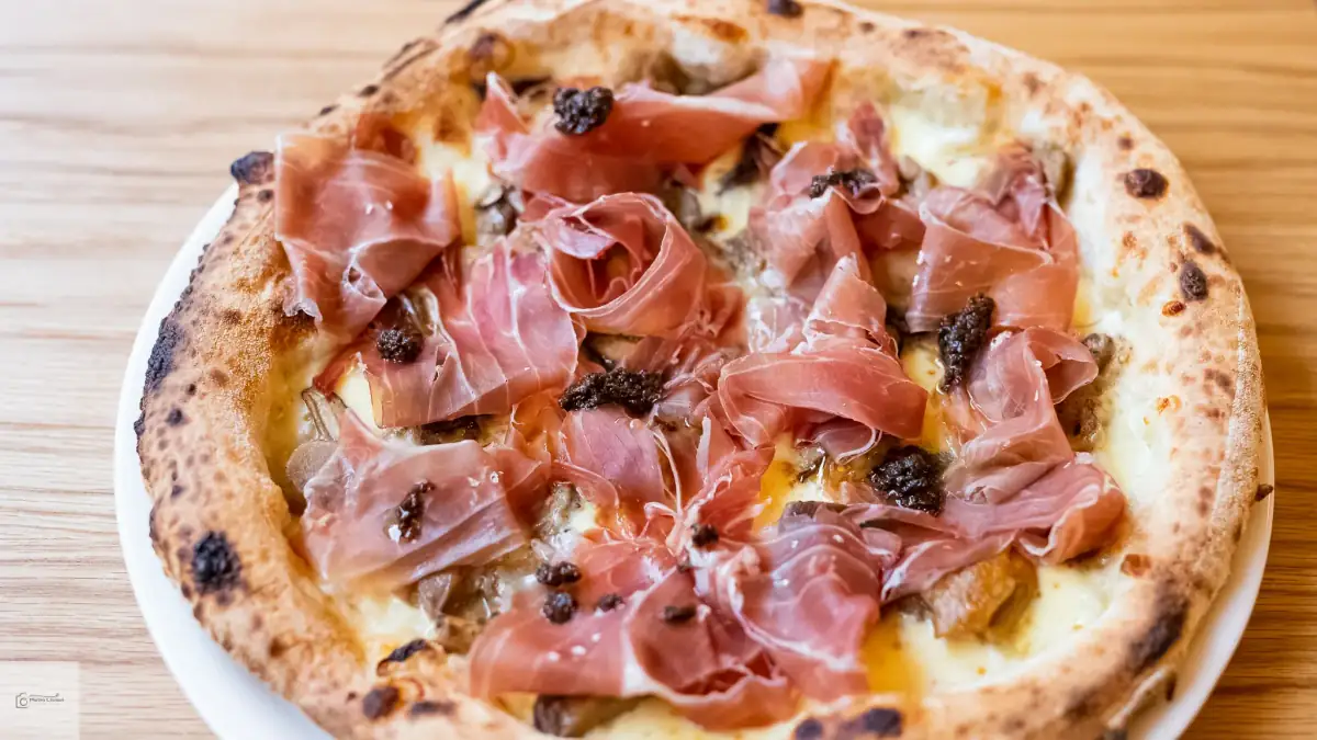 Bel Fiore Pizza Catering prosciutto crudo e tartufo — premium wood-fired white pizza with San Daniele prosciutto and black truffle, tasting menu Sydney